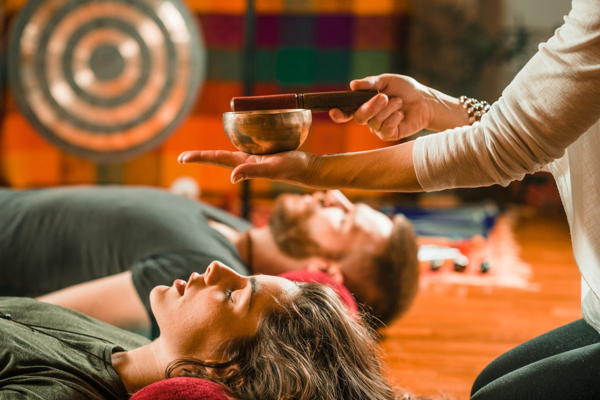 Sound therapy session with singing bowl.