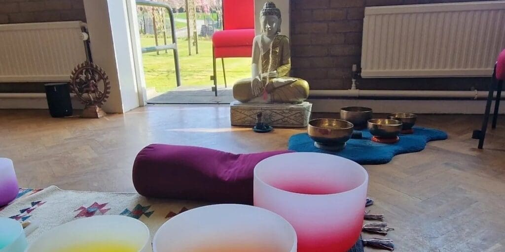 Meditation room with Buddha and singing bowls.